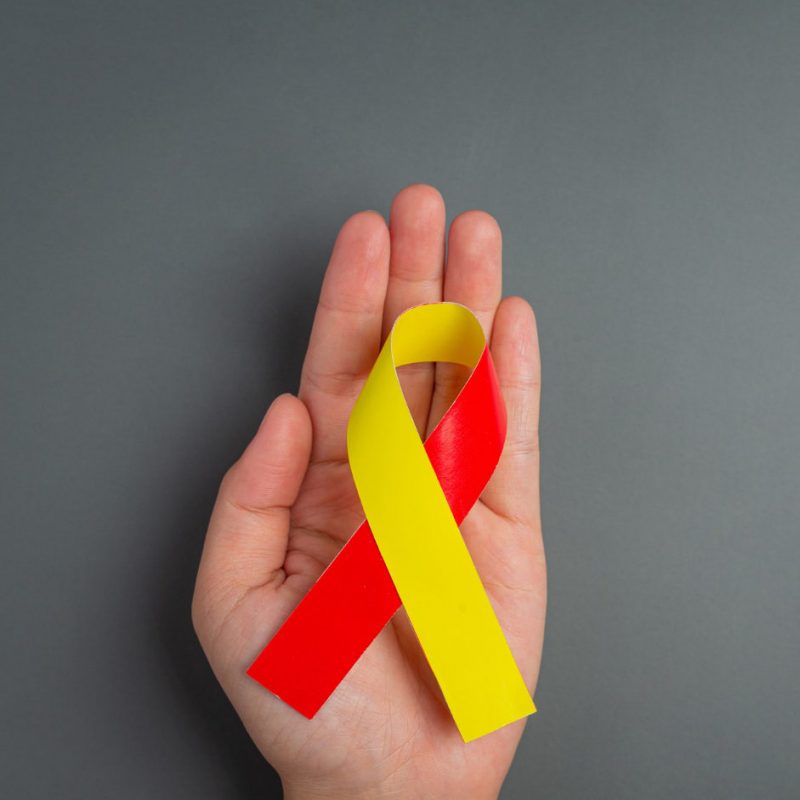 world-hepatitis-day-awareness-with-red-yellow-ribbon world-hepatitis-day-awareness-with-red-yellow-ribbon
